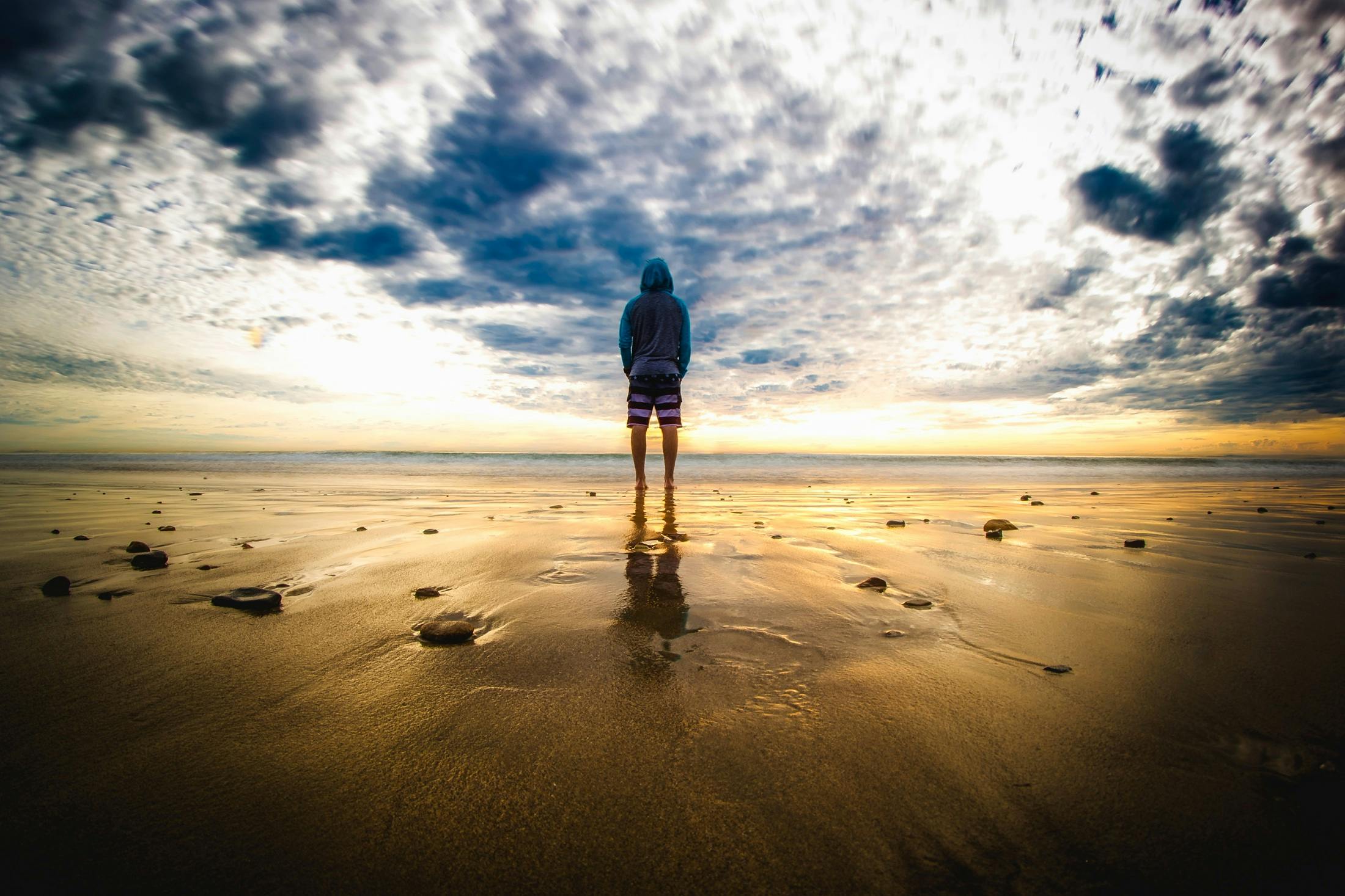 Person Standing on Sand